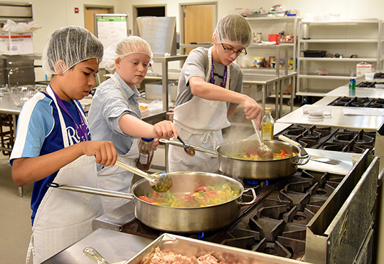 Middle school students learn about food science, food safety and cooking during Kansas State University Olathe summer camp.