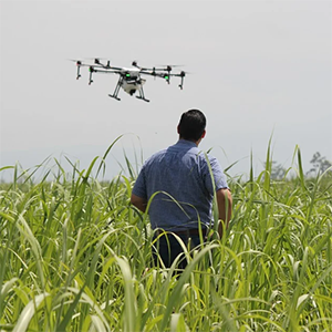Farmer using drone to monitor his crop.