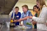 Blue Valley Middle School students added fresh lime and other seasonings to their salsa. The goal was to make salsa from scratch without contaminating it during the preparation process.