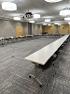 Room with tables in a U-shape setup. 