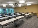 Room with tables set up in rows.