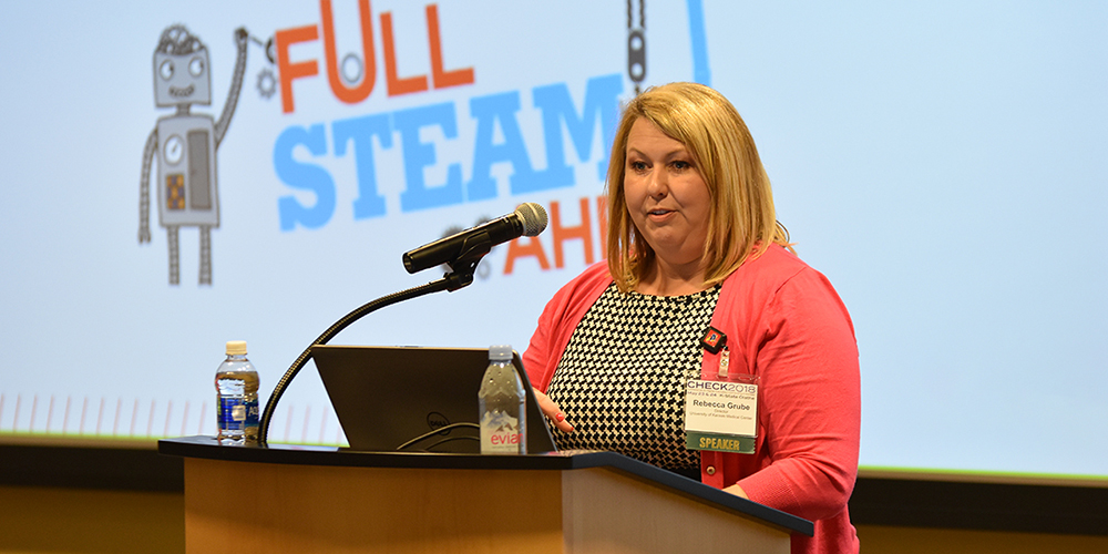 Woman talking at a podium. 