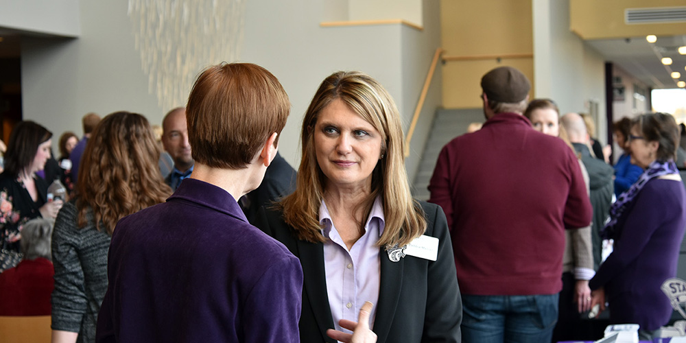 People mingling at the K-State Olathe campus.