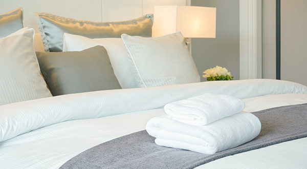 Hotel bed with towels