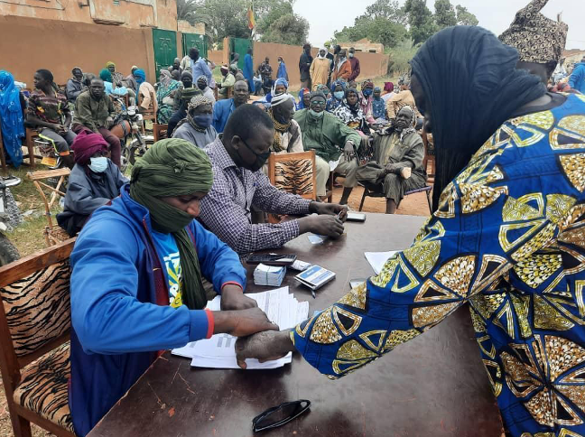 A participant was recorded through fingerprinting before food distribution in the Segou region, Niono cercle.