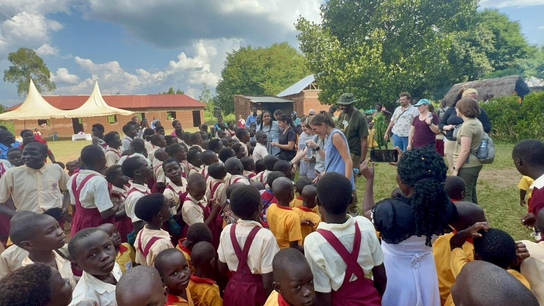 Mississippi State University veterinary students engage with children in a Ugandan community as part of a cultural immersion and public outreach activity.